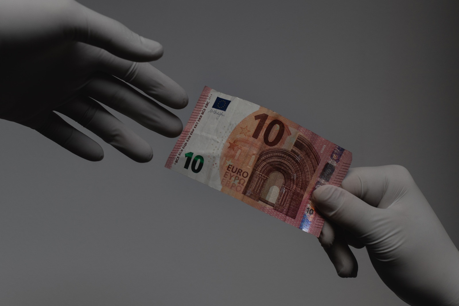 Accessing finance after COVID-19 - people handling money with gloves